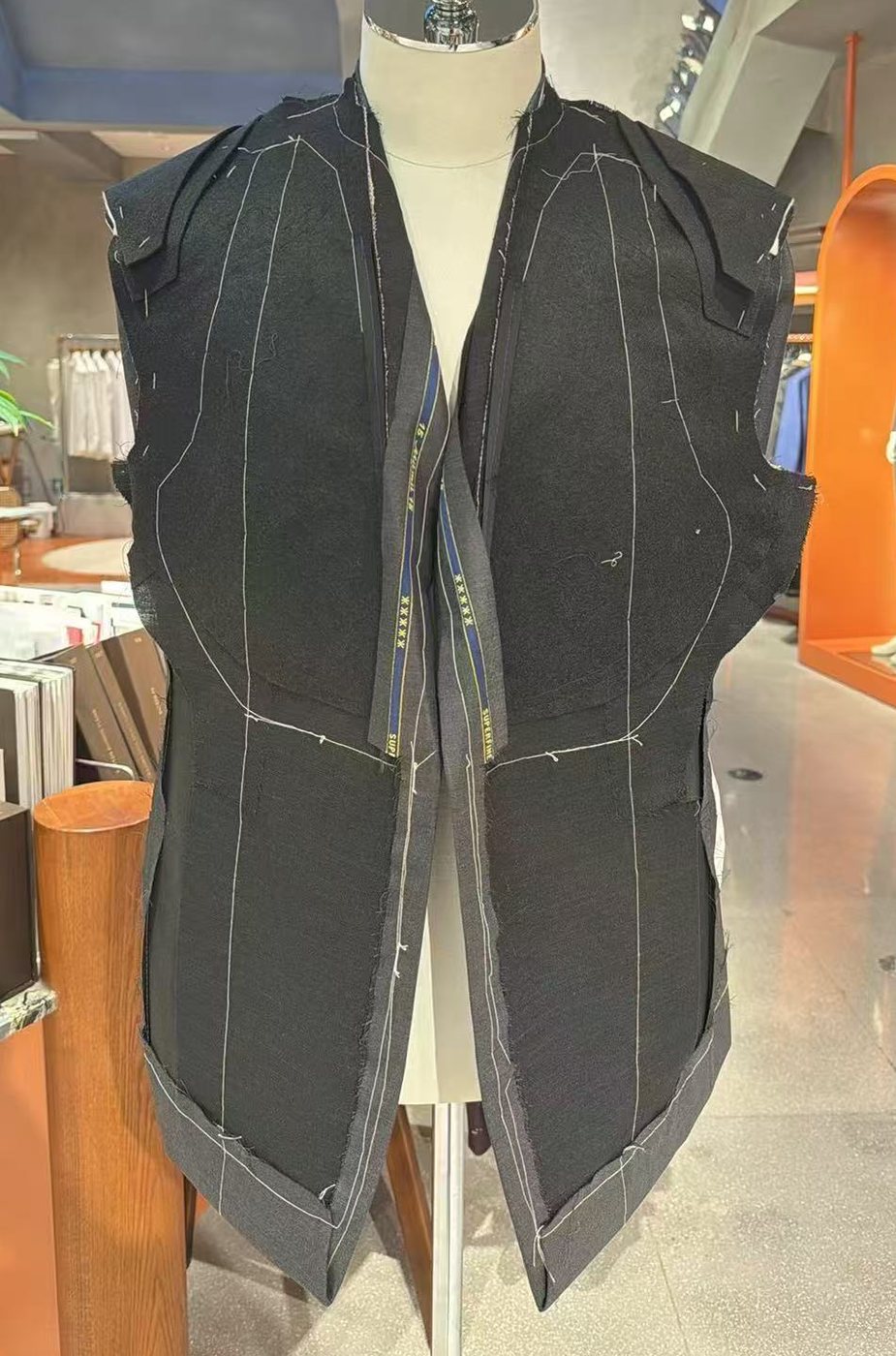 A full-canvas front with machine work through the body and hand work at the chest and lapel
