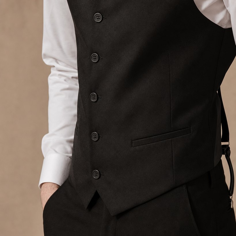 Black Wool Waistcoat Worn as Outer Layer — fabric close-up
