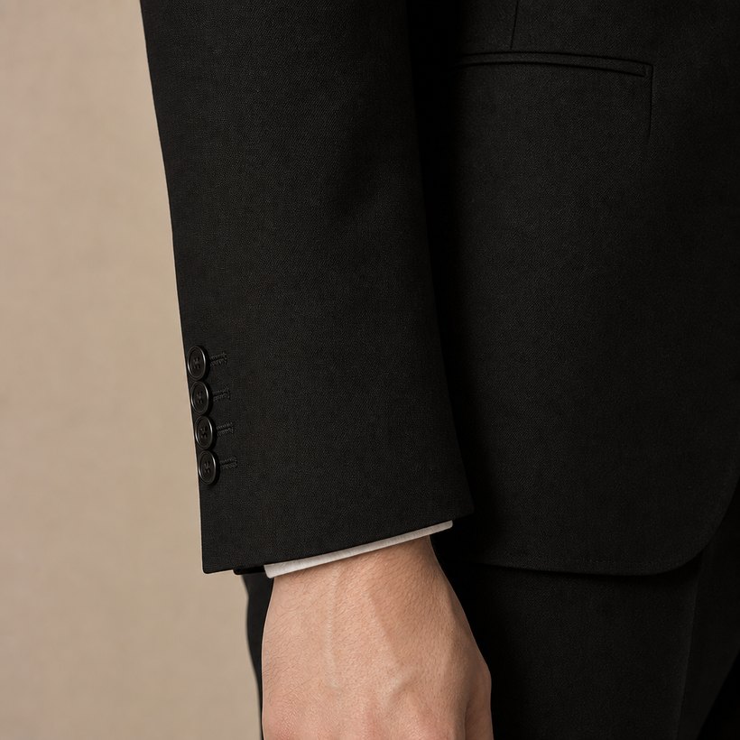 Slim Black Wool Two-Button Suit — fabric close-up